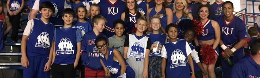 Kids posing with cheerleaders - our program